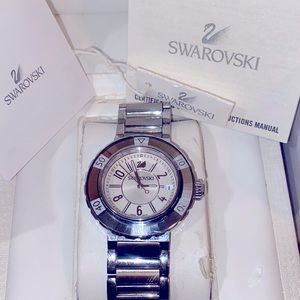 UNISEX authentic Swarovski whit crystal sapphire bezel and markers .